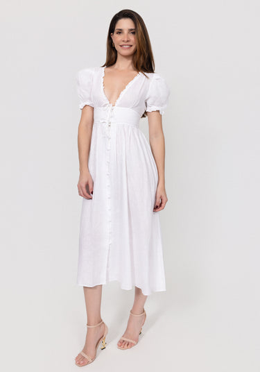 Woman wearing a white Linen Button-Front Midi Dress with Puff Sleeves & Tie Detail against a plain background
