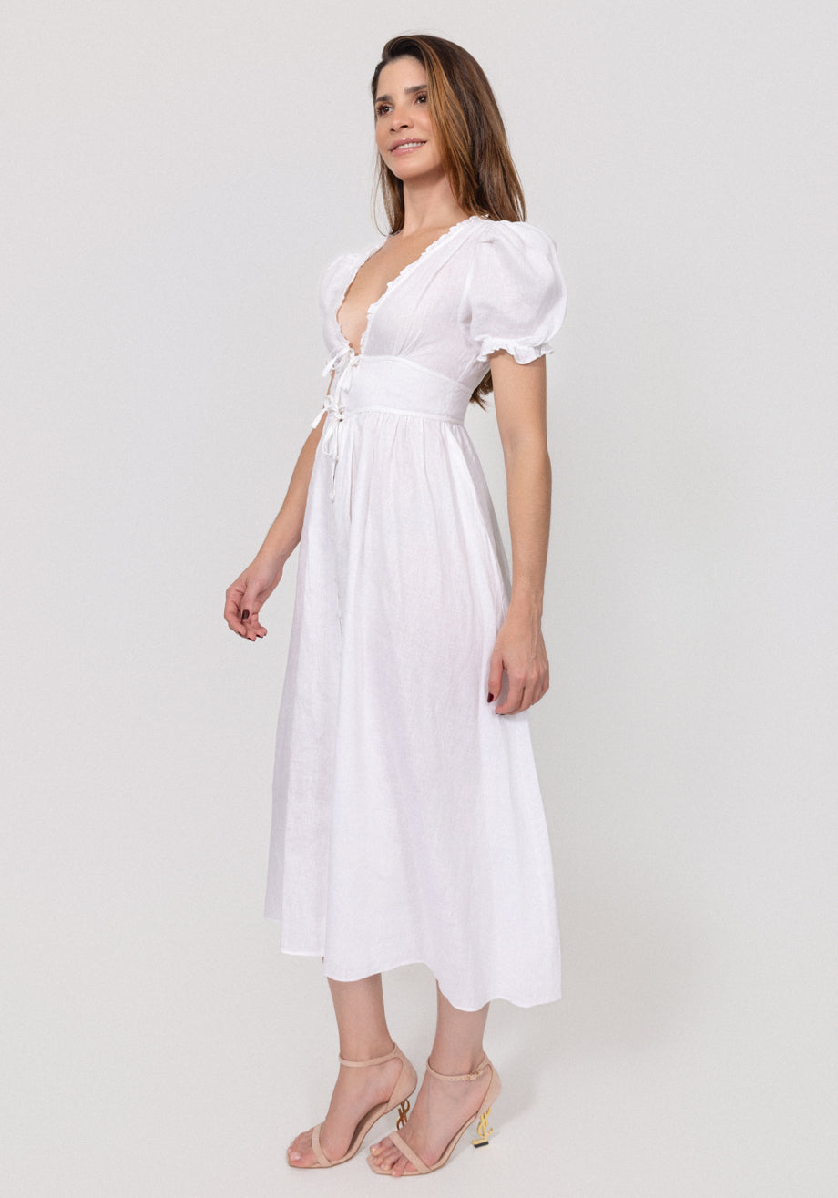 Woman wearing a white Linen Button-Front Midi Dress with Puff Sleeves & Tie Detail on a plain background