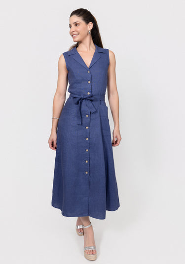 Woman wearing a navy blue linen dress with a belt on a white background