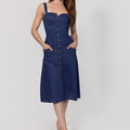 Woman wearing a navy blue Midi Linen Dress With Front Buttons & Pockets with buttons on a white background