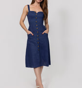 Woman wearing a navy blue Midi Linen Dress With Front Buttons & Pockets with buttons on a white background