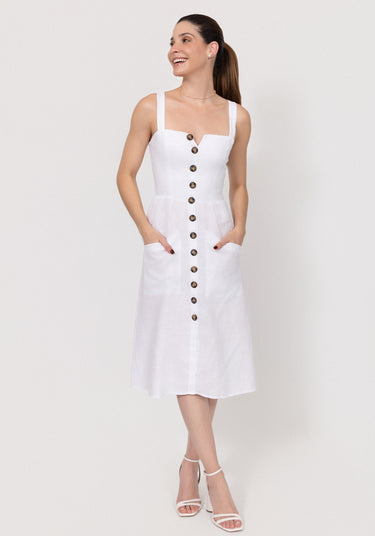 Woman wearing a white Midi Linen Dress With Front Buttons & Pockets with buttons on a plain background