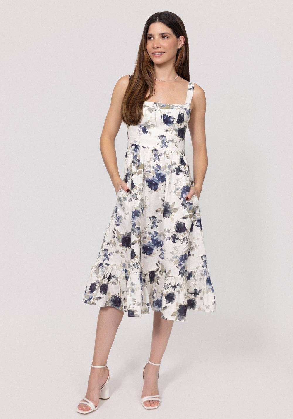 Woman wearing a floral Romantic Linen Midi Dress With Front Tie & Soft Ruffle on a white background